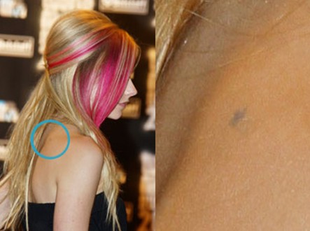 Avril-Lavigne-tattoos-tiny-star-tattoo-on-back5