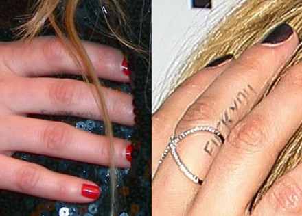 Avril-Lavigne-tattoos-–-‘FUCK-YOU’-finger-tattoo911