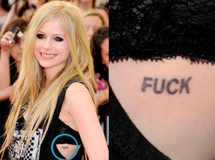 Avril-Lavigne-tattoos-–-‘FUCK’-tattoo-on-her-ribcage910